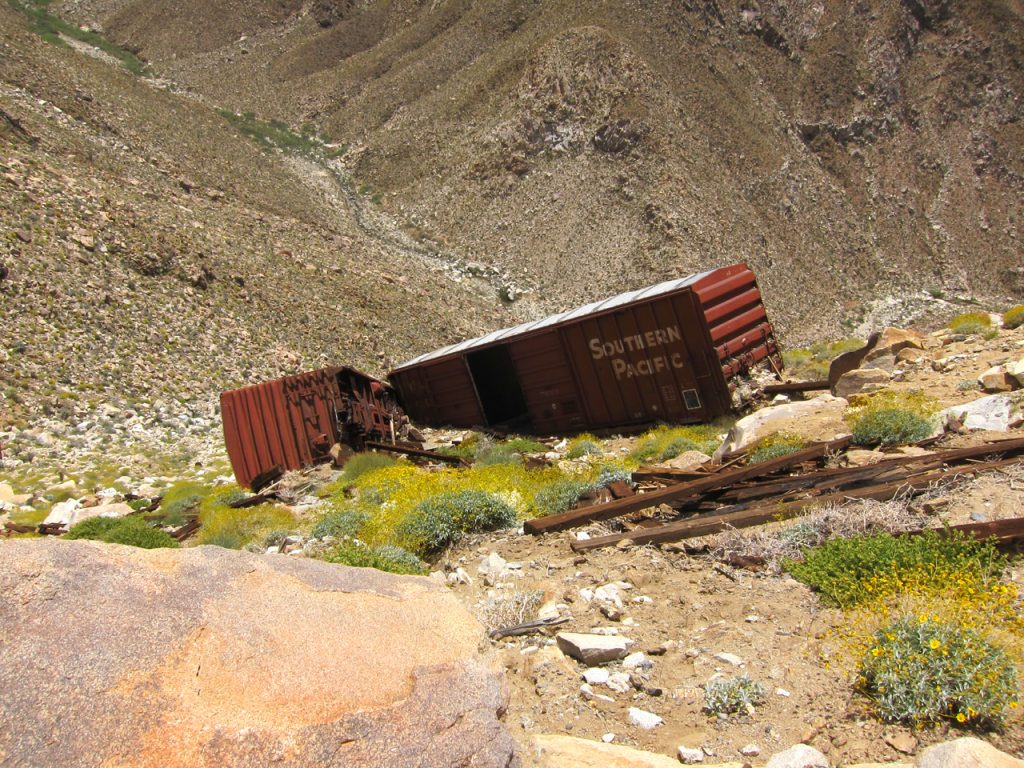 Old box cars that were apparently pushed off the Carrizo Gorge railway